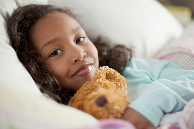Girl holding teddy bear